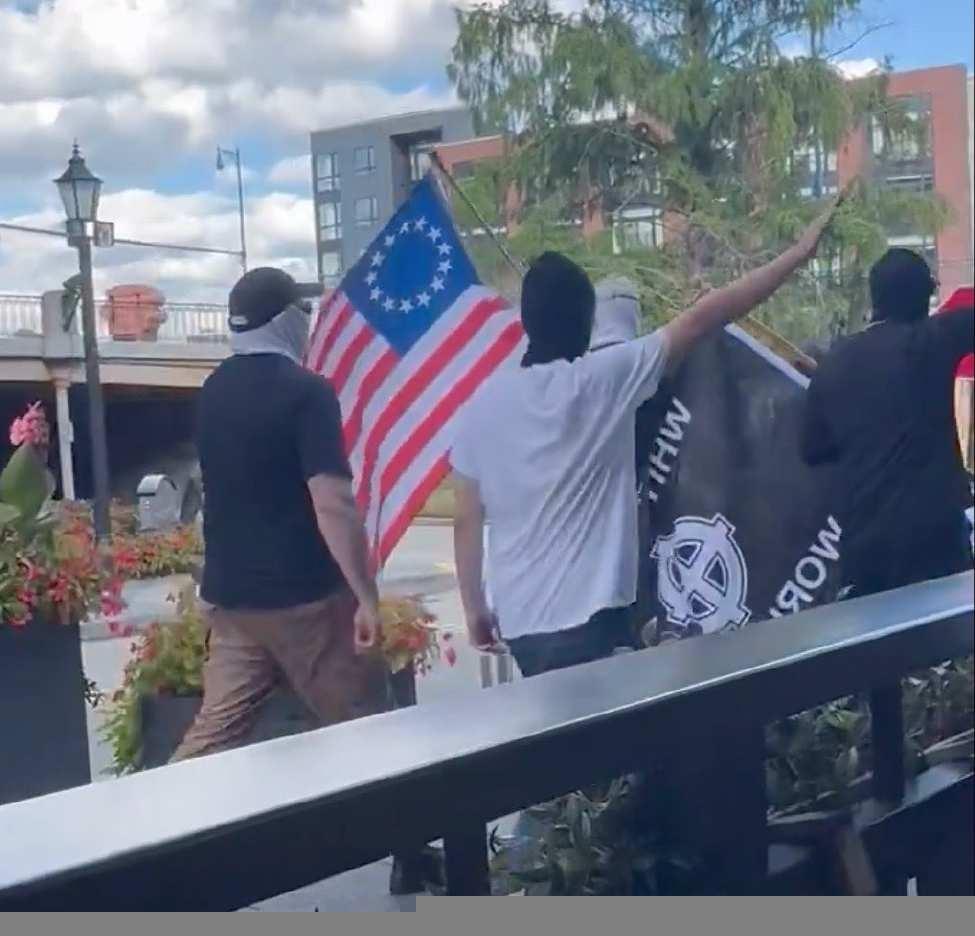 One of the WLM stooges throwing a nazi salute as they walk back to their cars on August 10th.