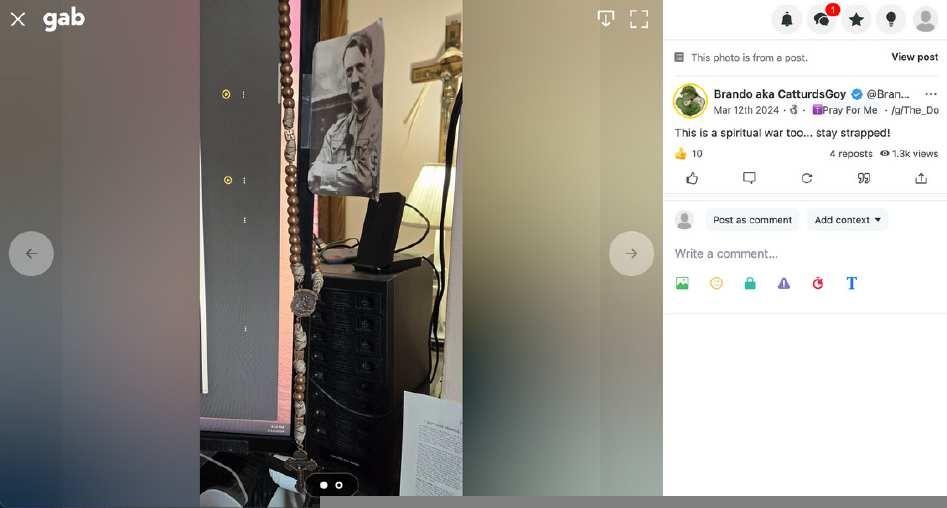 Picture Brandon posted to Gab of Adolf Hitler taped to his computer monitor.